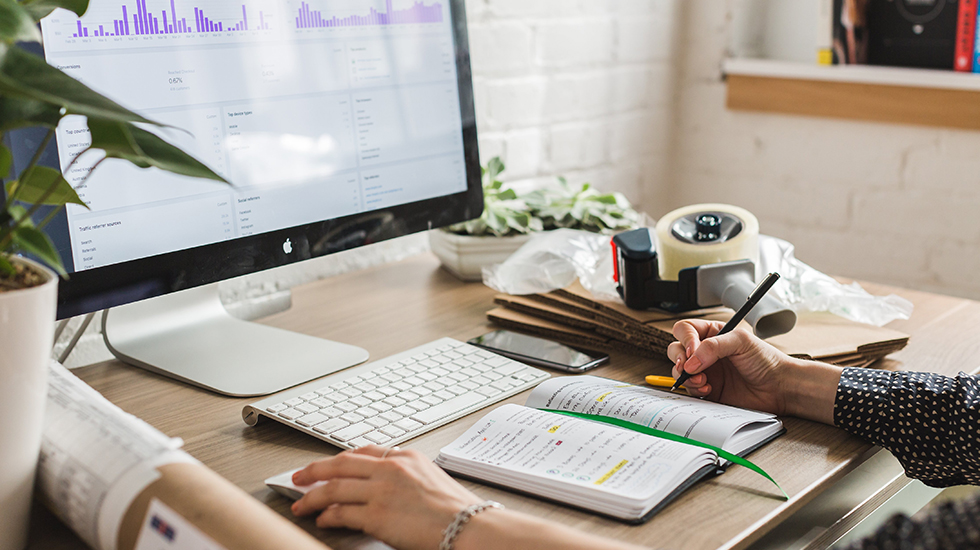 Person at desktop with analytics