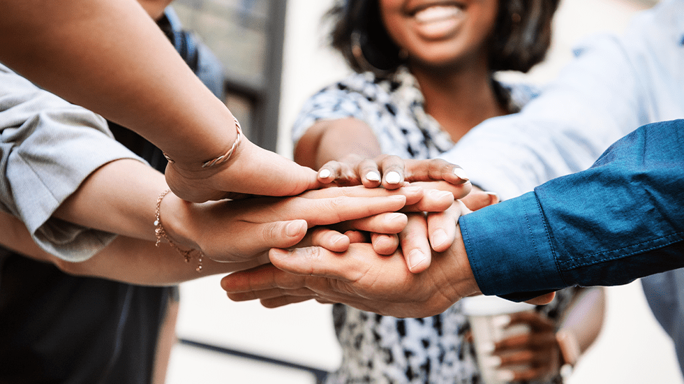 diverse team in a huddle